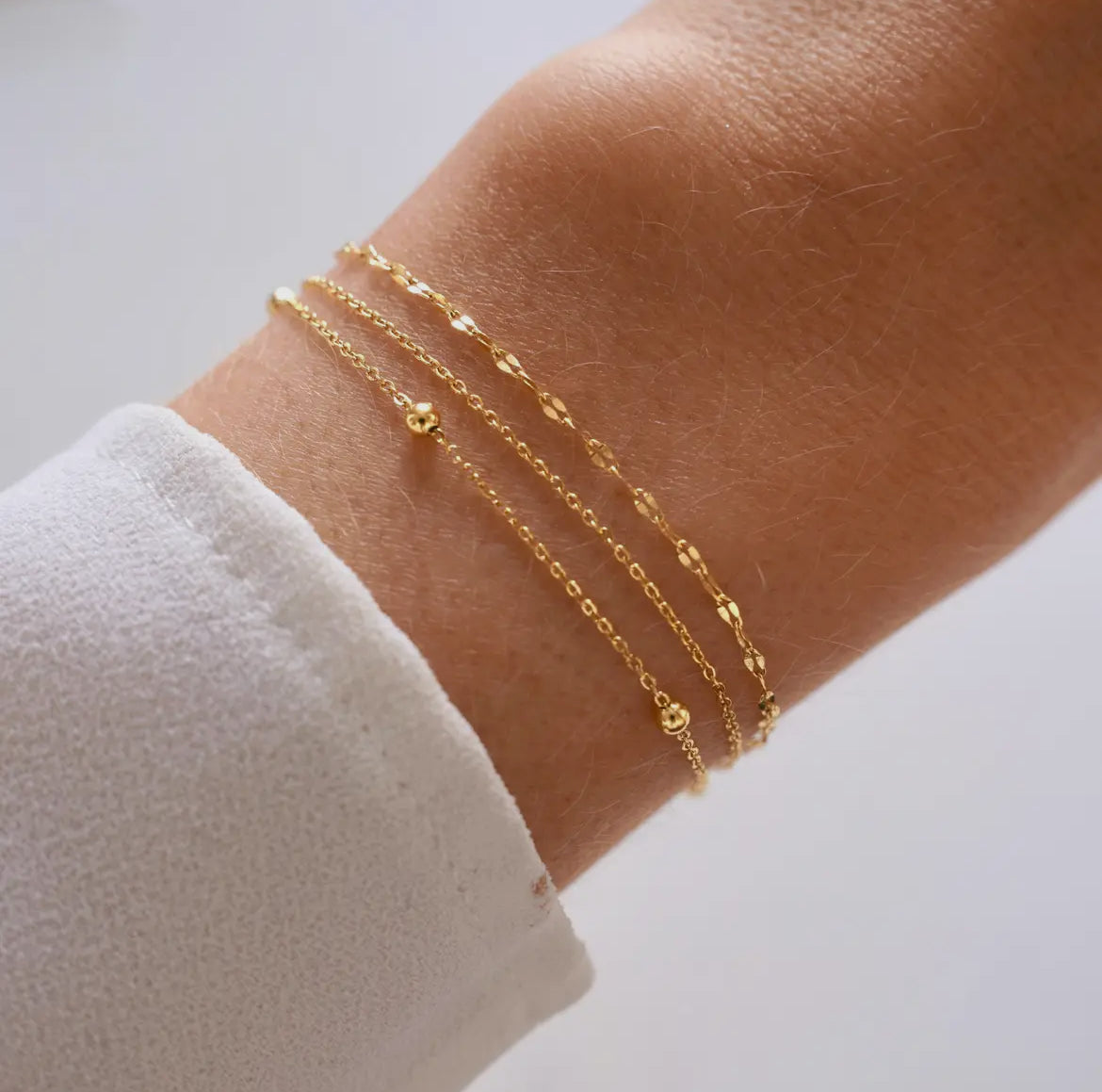 „Armband mit Dreifacher Kette – Minimalistisch & Edel“